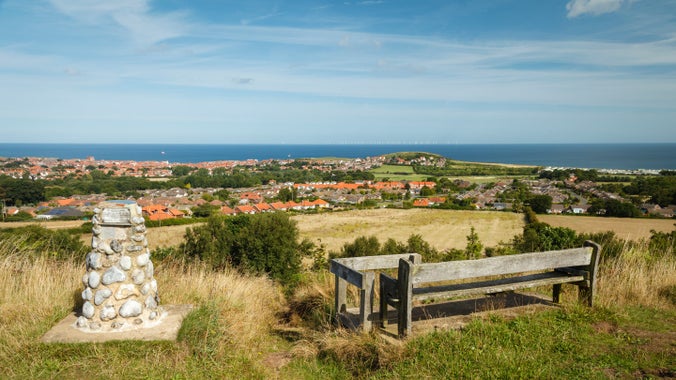 Summer view looking toward Beeston Bump and the sea from Stone Hill at West Runtonk